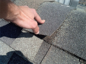 Roof inspection on roofing ridge