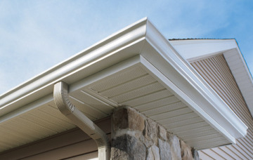 Gutter coil with soffit panels